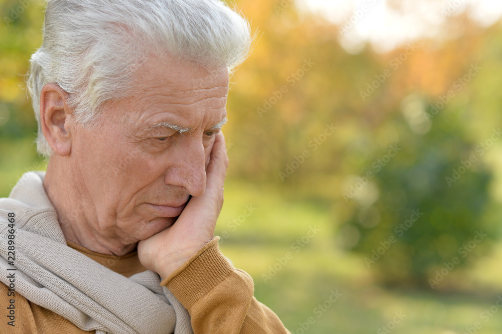 Portrait of a sad senior man outdoors Portrait of a sad senior man outdoors