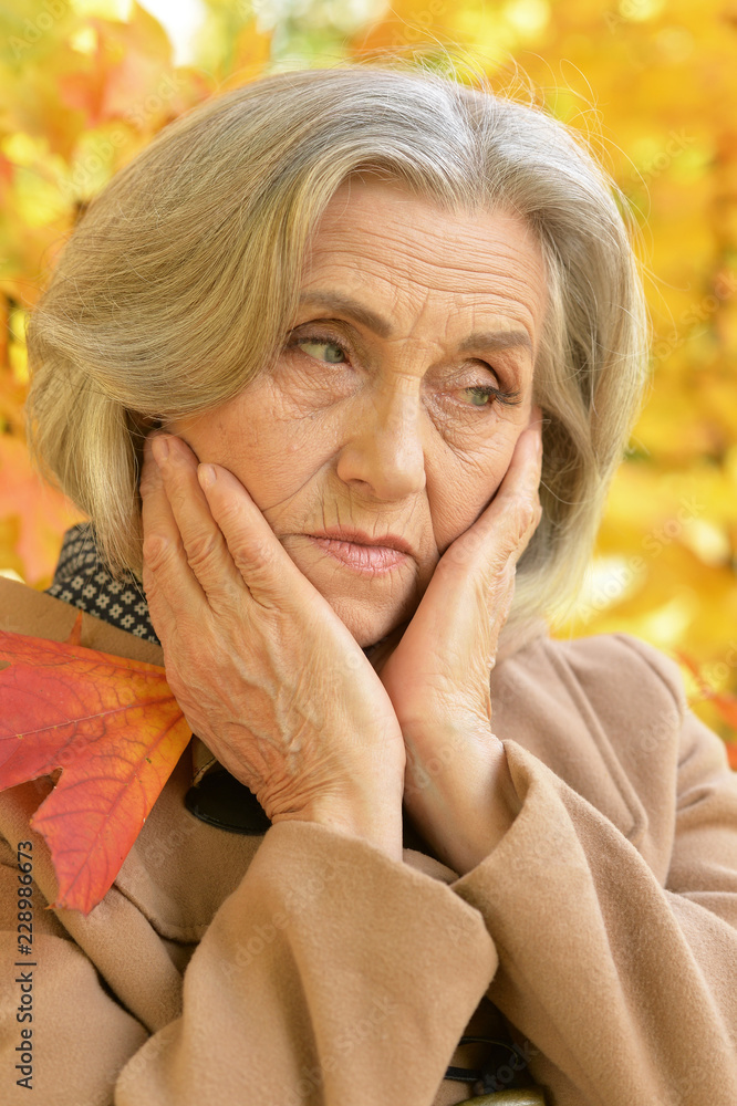 Portrait of a sad woman holding leaves Portrait of a sad woman holding leaves