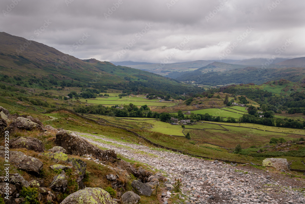 Scenic view of Duddon valley in the Lake District National Park, UK. Many footpaths suitable for hiking in beautiful English countryside. Scenic view of Duddon valley in the Lake District National Park, UK. Many footpaths suitable for hiking in beautiful English countryside.
