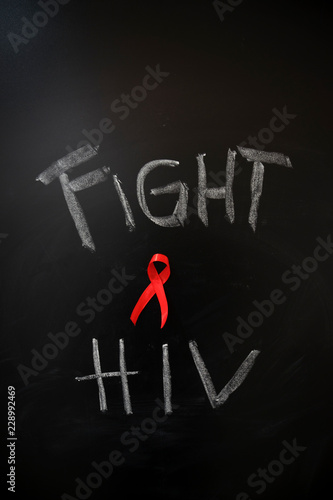 Text of fight HIV with red ribbon photo