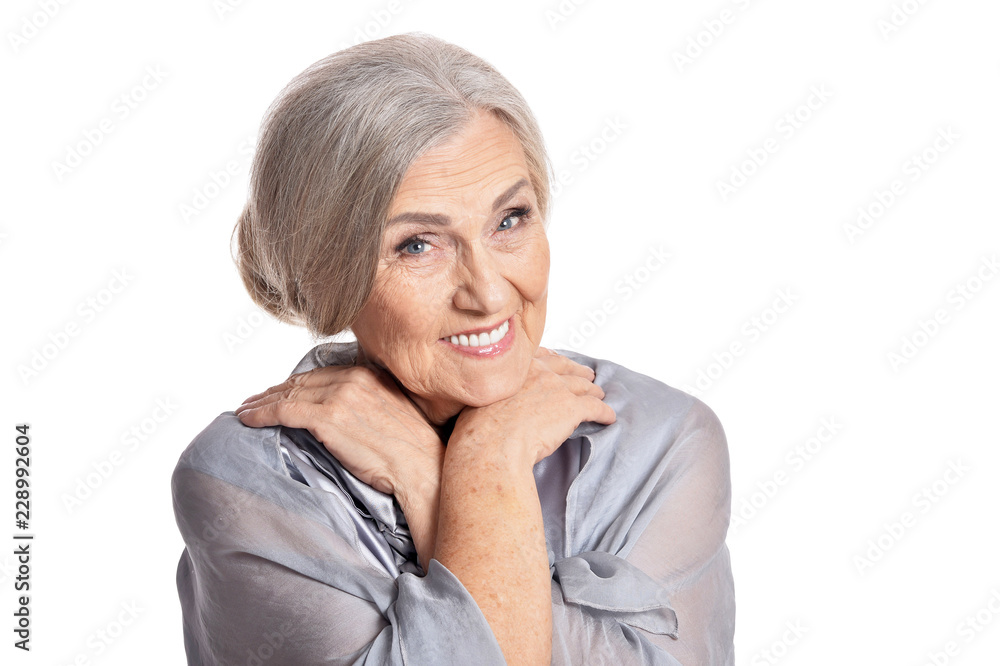 Portrait of a beautiful senior woman posing on white background Portrait of a beautiful senior woman posing on white background