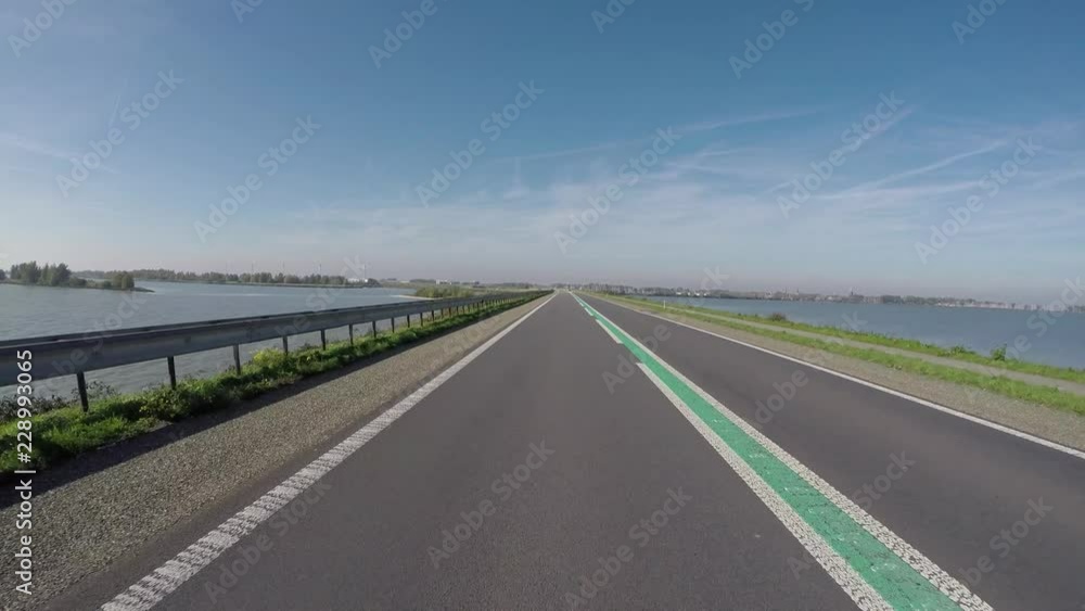 POV Driving on Houtribdijk dike in the Netherlands at the ijselmeer POV Driving on Houtribdijk dike in the Netherlands at the ijselmeer