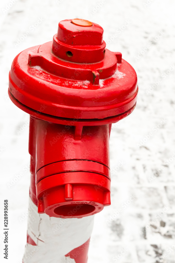 fire extinguishing system hydrant metallic red close-up adapter for hose against a background of snowy area