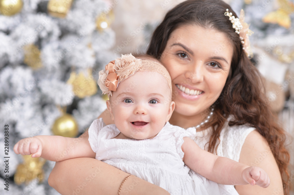 Mother with cute daughter posing in room Mother with cute daughter posing in room