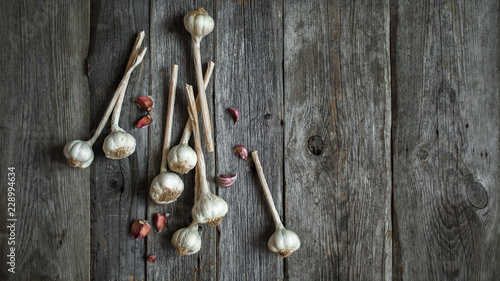 Bunch of garlic heads shot from above on wooden background