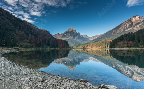 autumn color mountain landscape and lake in the Swiss Alps photo