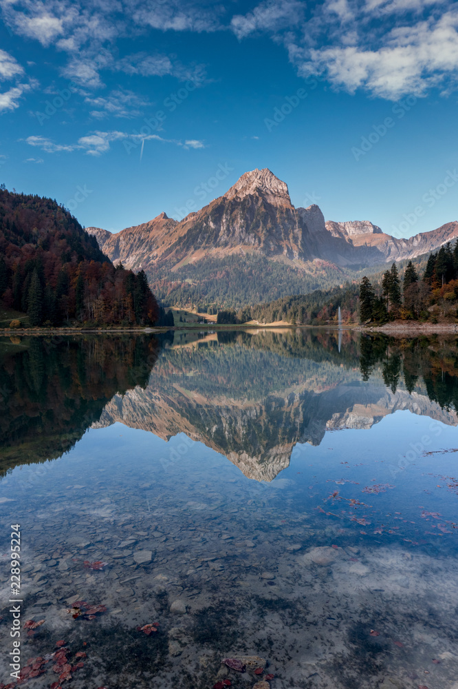 autumn color mountain landscape and lake in the Swiss Alps