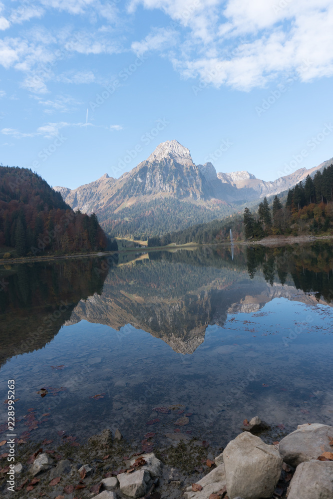 autumn color mountain landscape and lake in the Swiss Alps autumn color mountain landscape and lake in the Swiss Alps