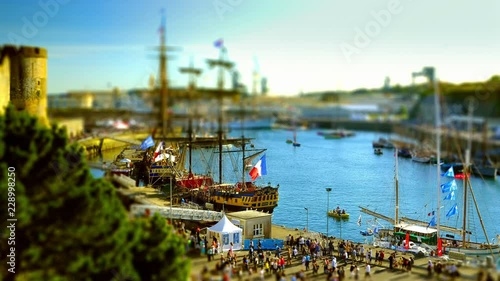 Brest, France - July 14, 2016: Old rigging under the castle in the harbor of Brest with Etoile du Roy and Hermione, the lafayette's ship  - Tilt shift on the Brest's International Maritime Festival. photo