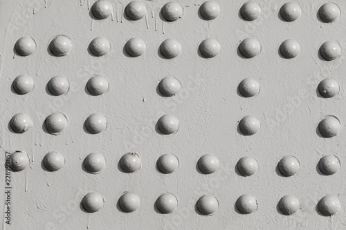 Grunge white metal iron texture background with buttons and space for text or image