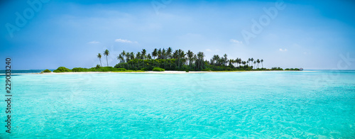 Beautiful beach with white sand at tropical Olhuveli island, Maldives. photo