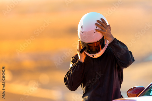 A Driver At Racing School Putting His Helmet On Before Taking His Car On To The Track. © Brendt Petersen