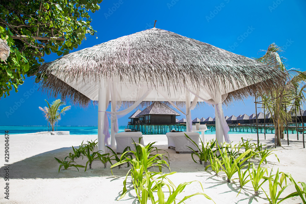 Massage Pavilion at beautiful tropical  beach and turquoise water , Maldives.