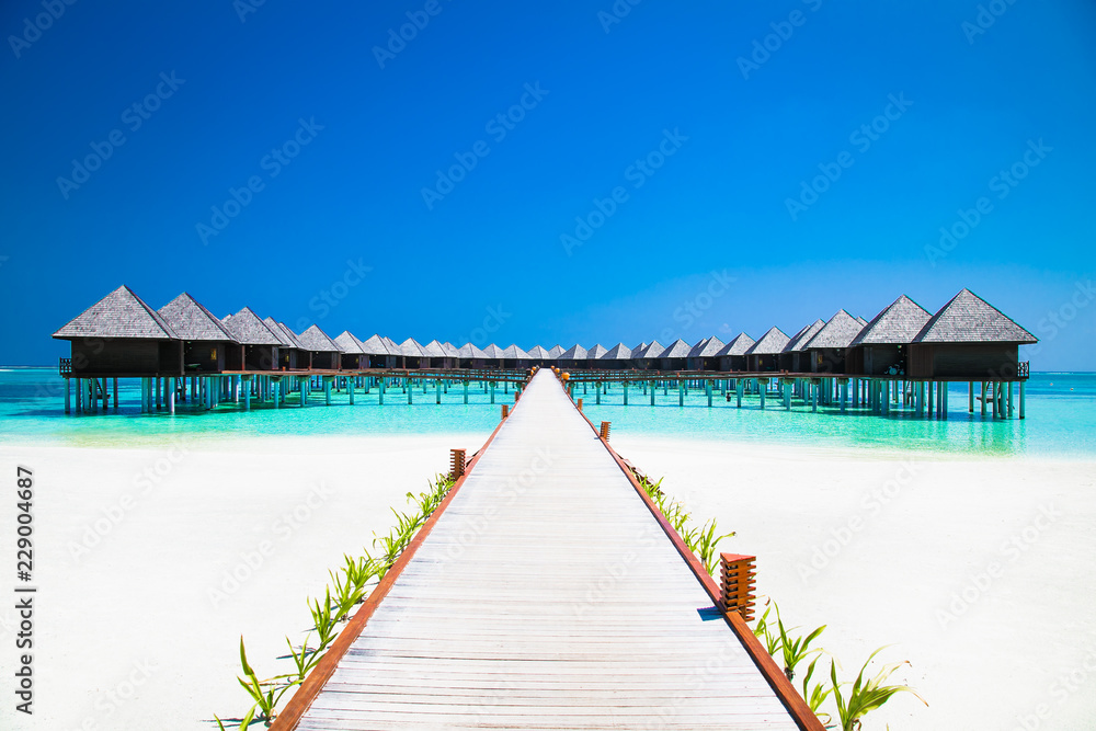 Beautiful tropical resort with wihte beach and turquoise water for relax on Olhuveli island, Maldives.