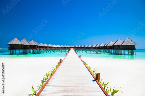Fototapeta Naklejka Na Ścianę i Meble -  Beautiful tropical resort with wihte beach and turquoise water for relax on Olhuveli island, Maldives.