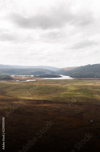 Open Tasmanian Landscape With Rolling Hills In Background