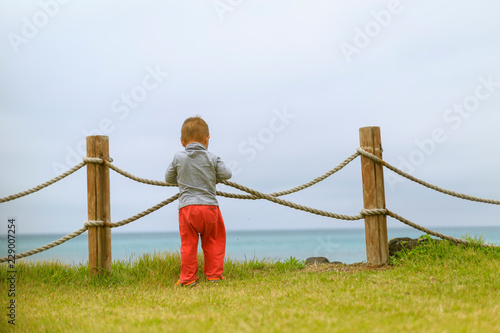 A baby with a fence near the ocean on Jeju Island in Korea