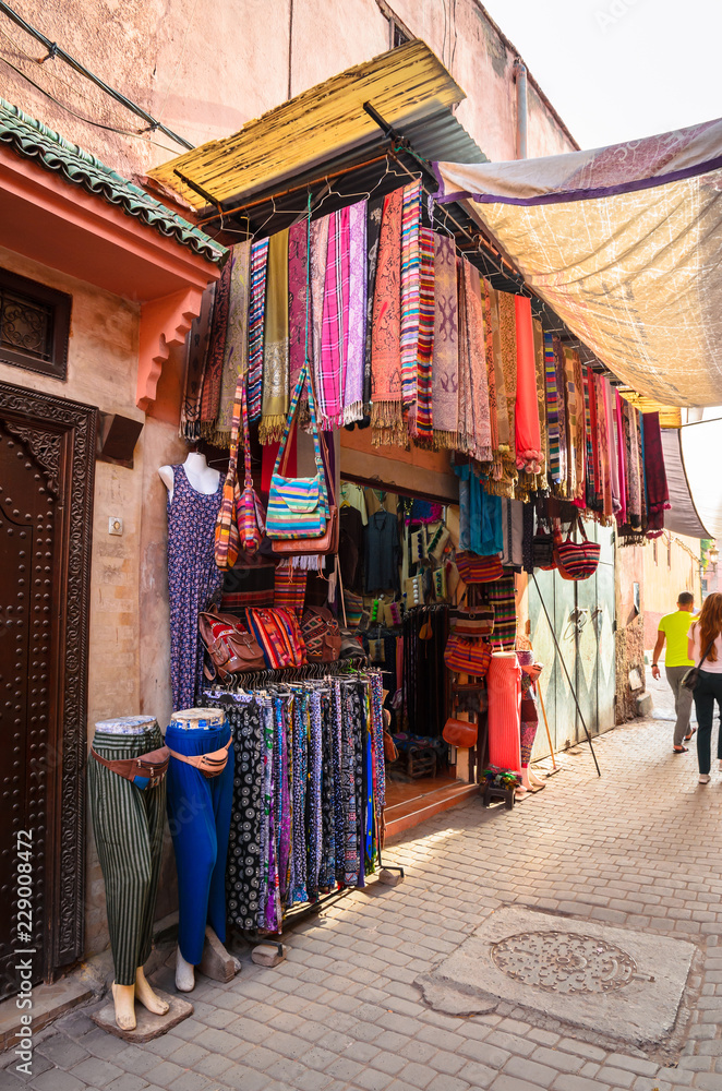 Street of Marrakech market with traditional souvenirs, Morocco