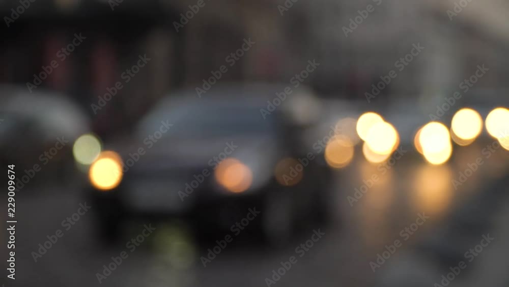 Road traffic. The movement of cars in the night city. Headlight light. Evening city. Road traffic. The movement of cars in the night city. Headlight light. Evening city.
