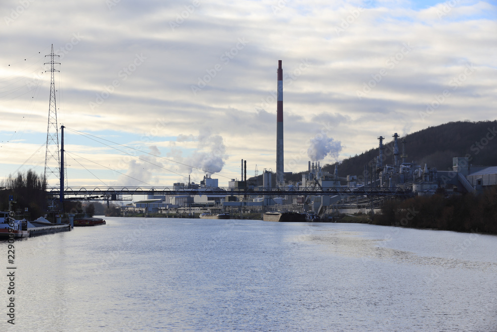 Chemical industries along a river at twilight Chemical industries along a river at twilight