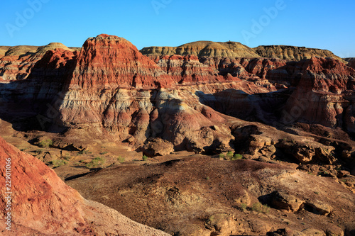 Rainbow City  Wucai Cheng. Colorful Red  Pink  Orange and Yellow landforms in a remote desert area of Fuyun County - Altay Perfecture  Xinjiang Province Uygur Autonomous Region  China. Exotic Scenery