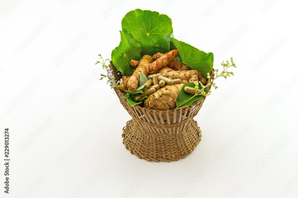 Assorted of herbal in brown bamboo basket   isolate on white background