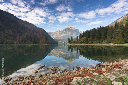 autumn color mountain landscape and lake in the Swiss Alps photo