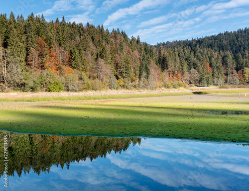 autumn color mountain landscape and lake in the Swiss Alps photo