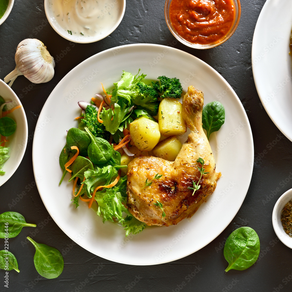 Grilled chicken leg with potato and green salad Grilled chicken leg with potato and green salad