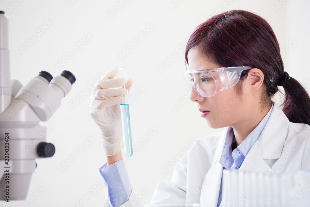 woman scientist take test tube woman scientist take test tube