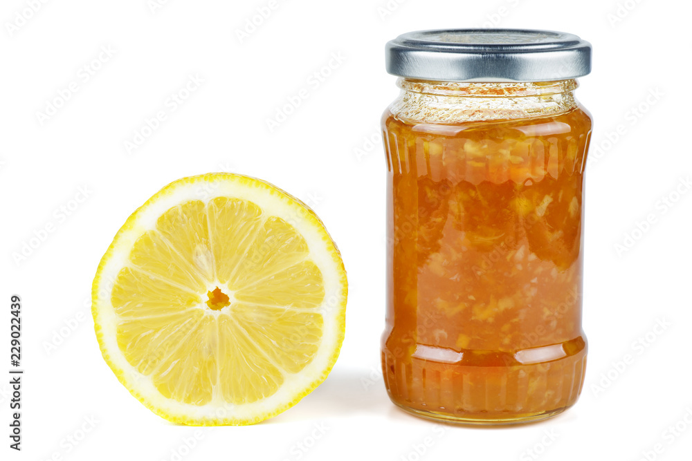 Half of lemon and Homemade jam in glass jar isolated on white background Half of lemon and Homemade jam in glass jar isolated on white background