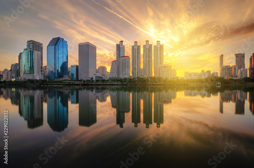cityscape panorama with buildings in city the and skyline of skyscraper in downtown landscape on morning golden hour twilight view from public city park metropolis. © thithawat