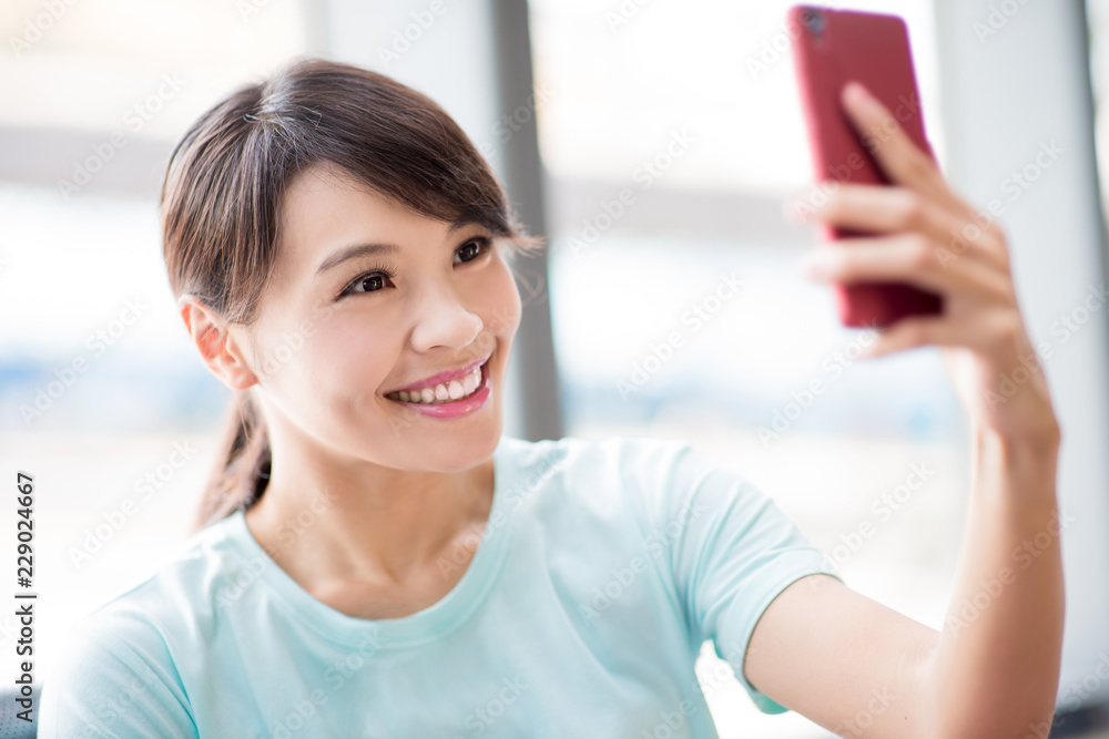 woman use phone selfie happily