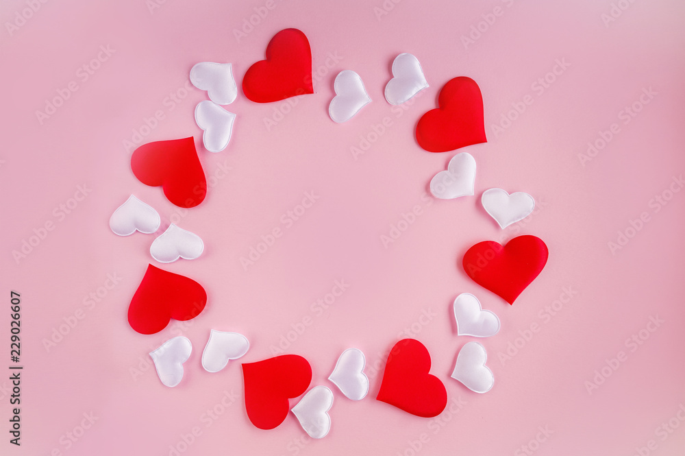 Pattern of red and white hearts on a pink background. Romantic concept for Valentine's Day.