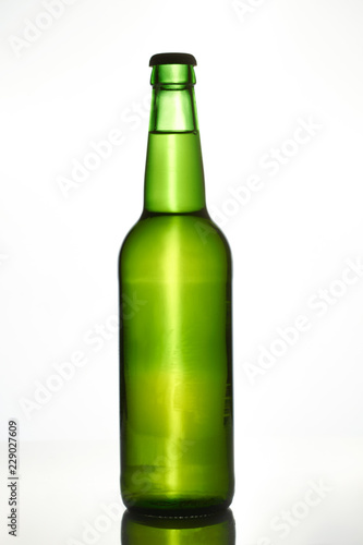 Green beer bottle. Isolated on white.