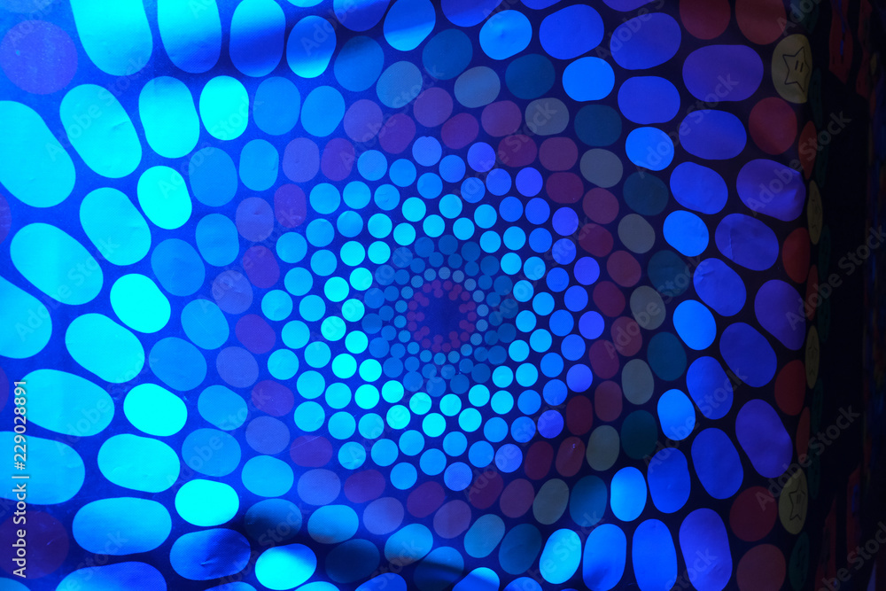 Εκτύπωση καμβά Spinning RGB colored hallucination on a wall