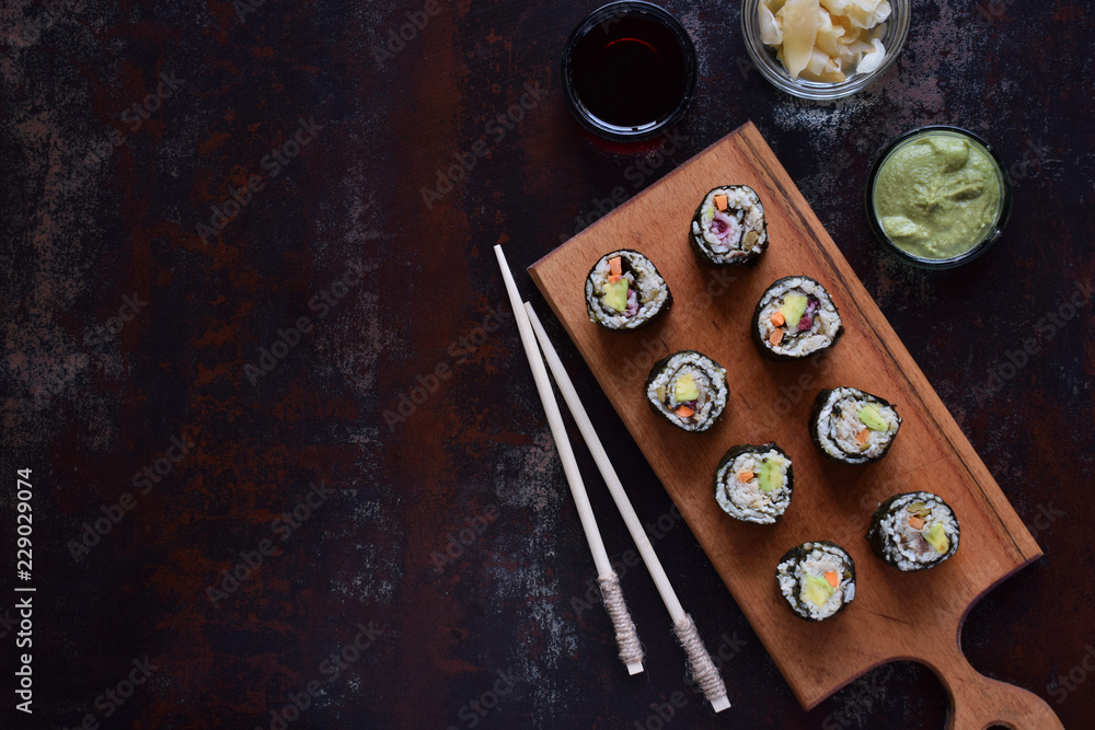 Sushi from cauliflower, avocado, tuna and carrots. Traditional Asian food. Diet healthy food concept. Cereals free. Gluten free. Dairy free. AIP Autoimmune Paleo. Copy space for text. Sushi from cauliflower, avocado, tuna and carrots. Traditional Asian food. Diet healthy food concept. Cereals free. Gluten free. Dairy free. AIP Autoimmune Paleo. Copy space for text.
