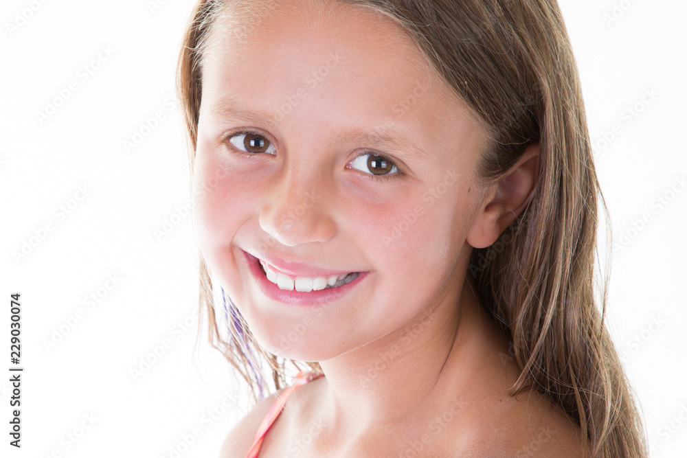 cute girl portrait posing isolated at blank studio wall looking at camera with happy smile cute girl portrait posing isolated at blank studio wall looking at camera with happy smile