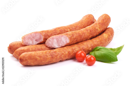 Sliced Sausages For Beer. Oktoberfest sausages with basil leaves, isolated on a white background. Close-up