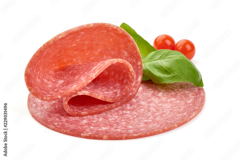 Semi-dry sausage slices with basil leaves and Physalia berry. Isolated on a white background. Close-up. Semi-dry sausage slices with basil leaves and Physalia berry. Isolated on a white background. Close-up.