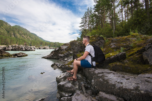 Woman resting at river in A...