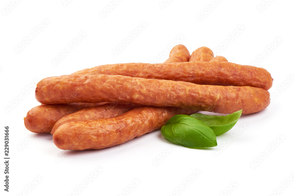 Sausages for beer. Oktoberfest sausages with basil leaves, isolated on a white background. Close-up. Sausages for beer. Oktoberfest sausages with basil leaves, isolated on a white background. Close-up.