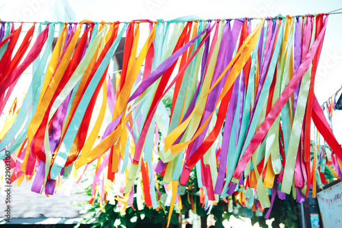 Multicolored ribbons fluttering in the wind. Silk ribbons in the wind