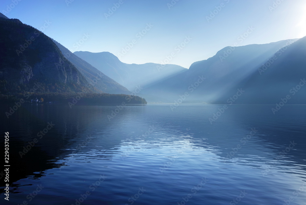 Morning foggy light over Hallstatt Lake in Salzkammergutt, Austria, Europe