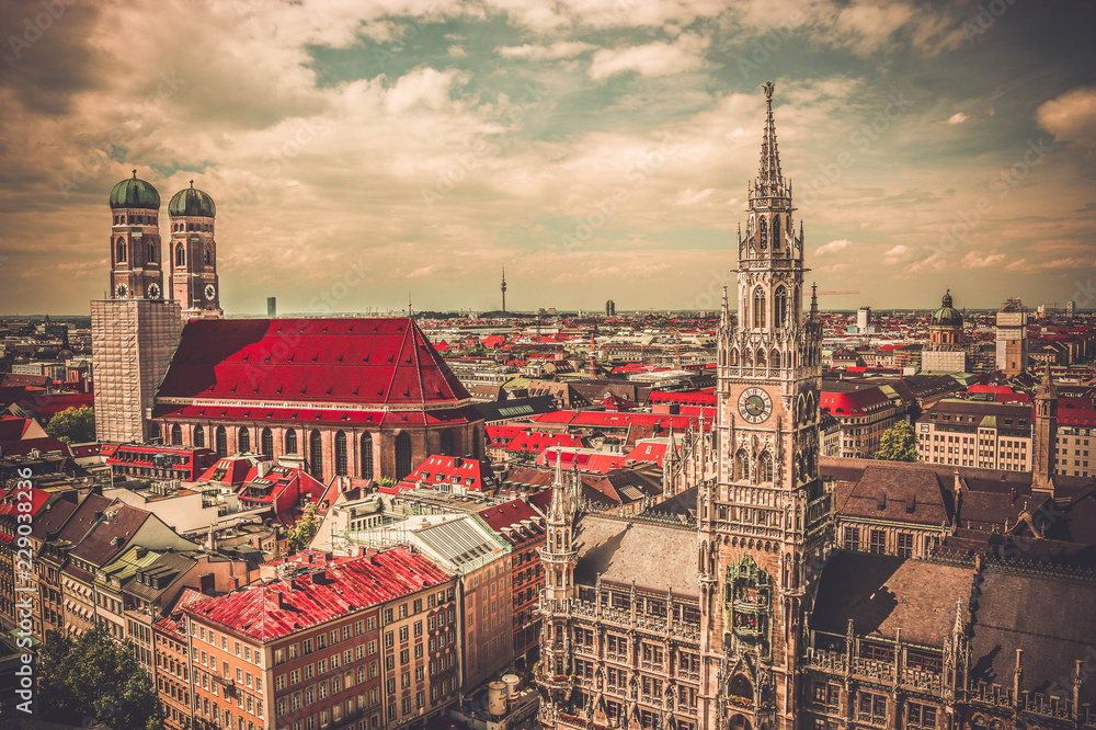Fototapeta premium Vintage photo city centre view of Marienplatz, New Town Hall (Neues Rathaus), Glockenspiel, Frauenkirche in Munich, Bavaria, Germany