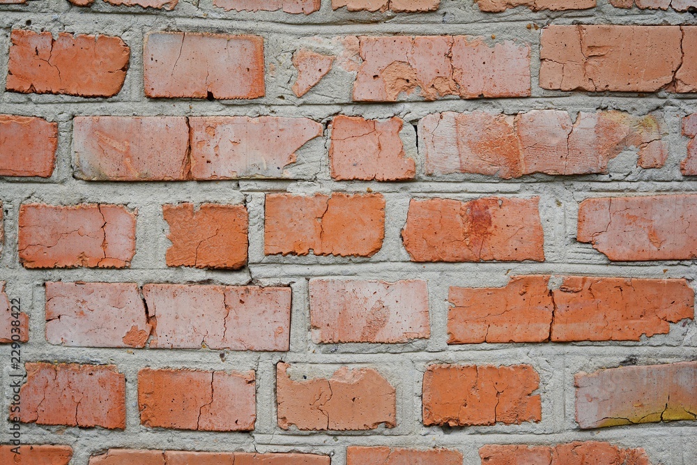 Old brick wall in a background image. Grungy Wide Brickwall. Grunge Red Stonewall Background. Shabby Building Facade With Damaged Plaster. Abstract Web Banner. Copy Space Old brick wall in a background image. Grungy Wide Brickwall. Grunge Red Stonewall Background. Shabby Building Facade With Damaged Plaster. Abstract Web Banner. Copy Space