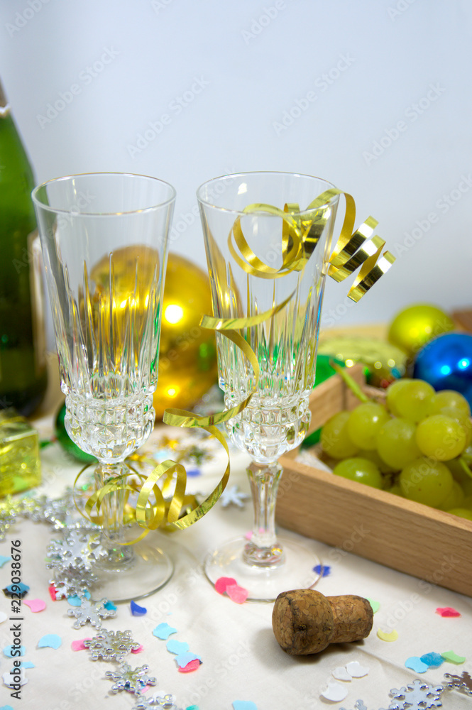Table ready to celebrate Christmas with tall glasses of champagne Table ready to celebrate Christmas with tall glasses of champagne