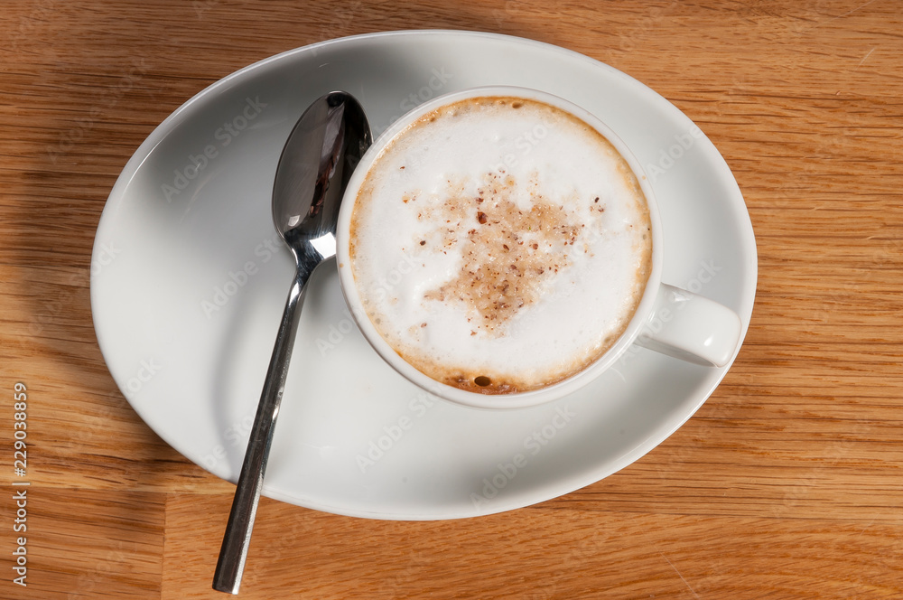 top view a cup of coffee and spoon top view a cup of coffee and spoon