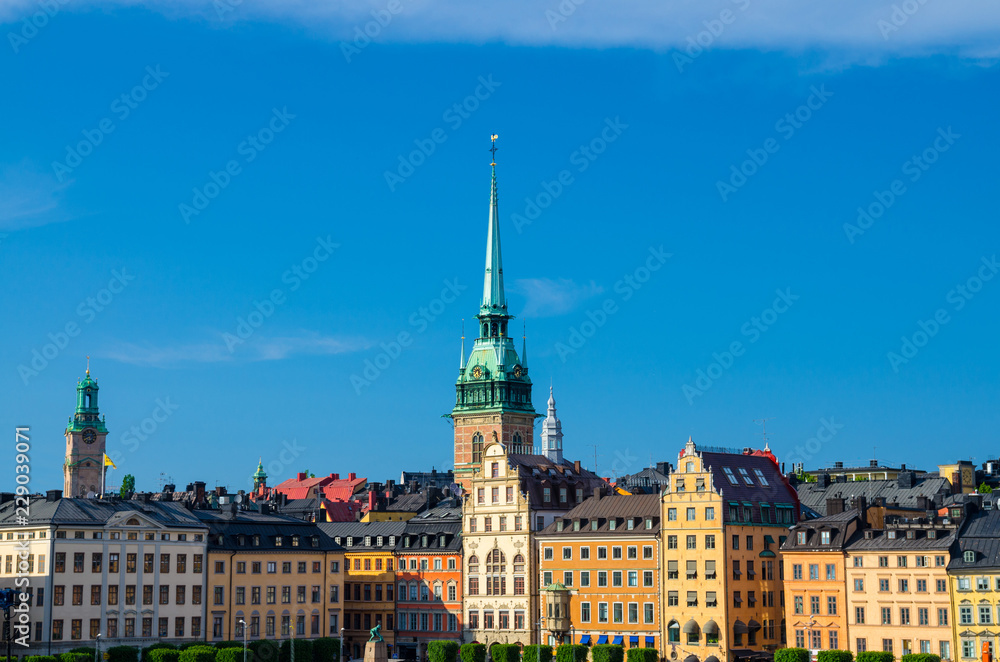 Fototapeta premium Traditional buildings with roofs and colorful walls, Stockholm, Sweden