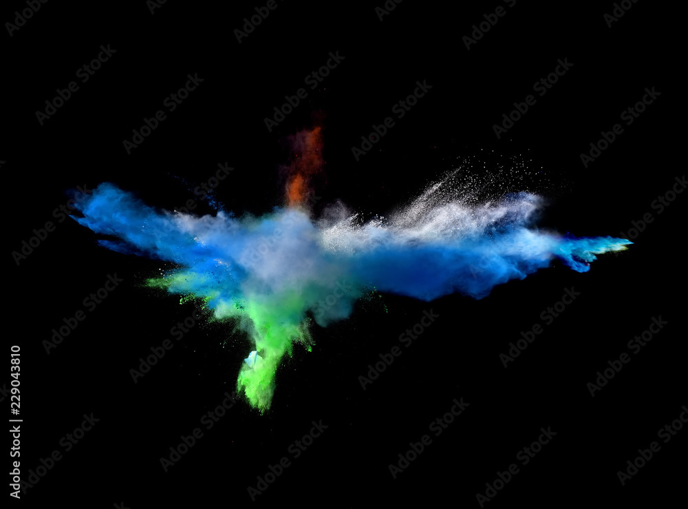 Fototapeta premium Fantastic forms of powder paint and flour combined together explode in front of a black background to give off fantastic explosions in bizarre multi colored cloud forms.
